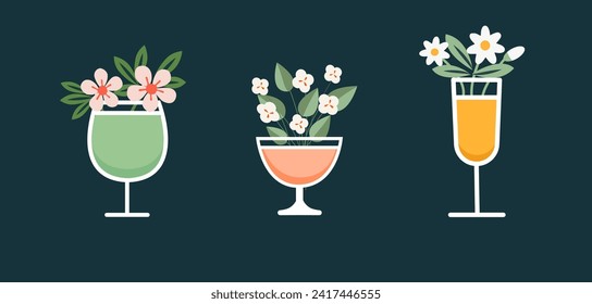 Wine or champagne, cocktail glasses with blooming flowers. Summer or spring party with floral drinks