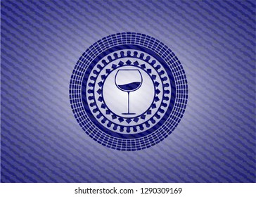 wine cup icon inside badge with jean texture