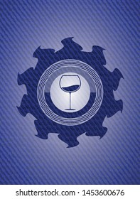 wine cup icon inside badge with denim background