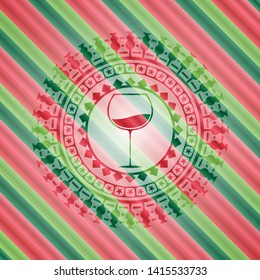 wine cup icon inside christmas style badge..