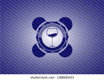 wine cup icon inside denim background