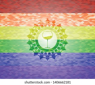 wine cup icon inside emblem on mosaic background with the colors of the LGBT flag