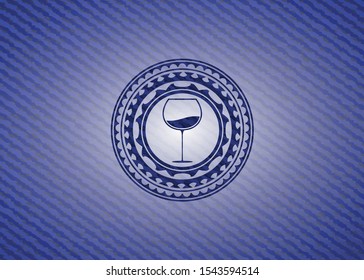 wine cup icon inside emblem with denim texture