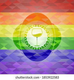 wine cup icon inside emblem on mosaic background with the colors of the LGBT flag. 