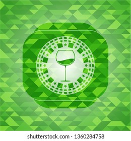 wine cup icon inside green emblem with mosaic background