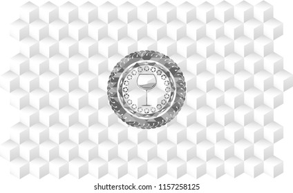  wine cup icon inside grey badge with geometric cube white background