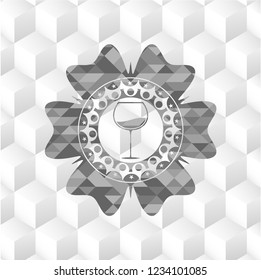 wine cup icon inside grey badge with geometric cube white background