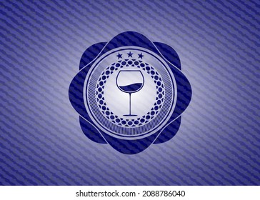 wine cup icon inside jean background. 
