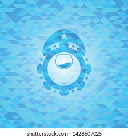 wine cup icon inside light blue emblem. Mosaic background