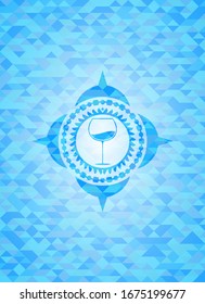 wine cup icon inside light blue emblem. Mosaic background