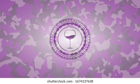 wine cup icon inside pink and purple camouflaged emblem
