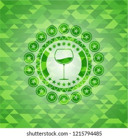 wine cup icon inside realistic green emblem. Mosaic background