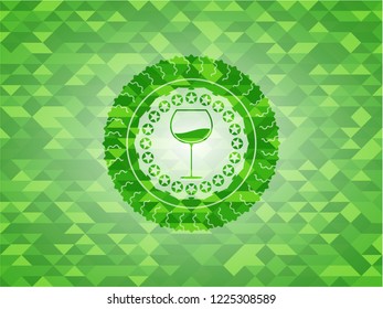 wine cup icon inside realistic green emblem. Mosaic background