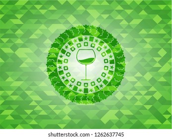 wine cup icon inside realistic green emblem. Mosaic background