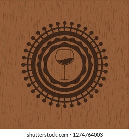 wine cup icon inside realistic wooden emblem