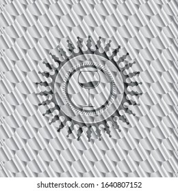 wine cup icon inside shiny silver emblem. Scales pattern. Vector Illustration. Detailed.