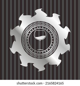 wine cup icon inside silvery emblem. 
