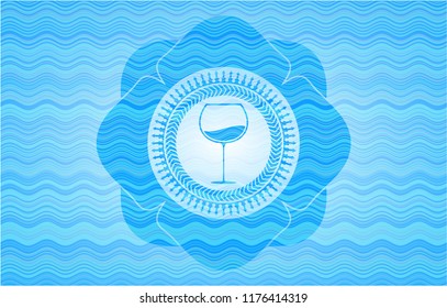 wine cup icon inside sky blue water wave emblem background.