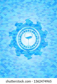 wine cup icon inside sky blue emblem. Mosaic background