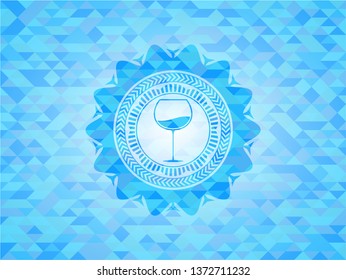 wine cup icon inside sky blue emblem with triangle mosaic background
