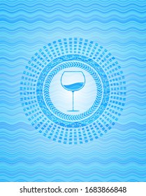 wine cup icon inside sky blue water emblem.