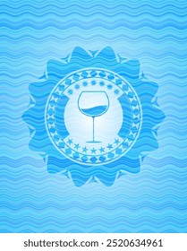 wine cup icon inside sky blue water wave emblem. 