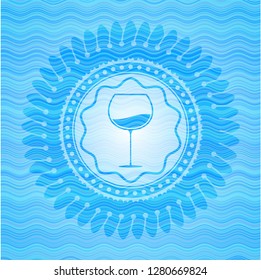 wine cup icon inside water concept emblem.