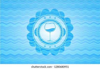 wine cup icon inside water wave representation style badge.