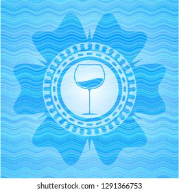 wine cup icon inside water concept emblem.