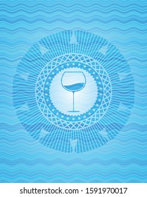 wine cup icon inside water representation style badge.