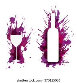 Wine glass and bottle in front of colorful grunge splashes