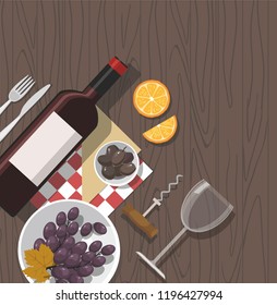 Wine glass, wine bottle, olives and grapes on wooden background. Wine tasting.