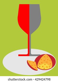 wine glass and cheese on a green background