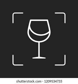 Wine glass. Linear, thin outline. White object in camera autofocus on dark background