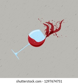 Wine glass with red wine with splashes and drops