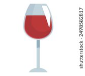 Wine glass standing on thin foot containing red wine with light reflecting on its surface