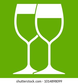 Wine glasses icon white isolated on green background. Vector illustration
