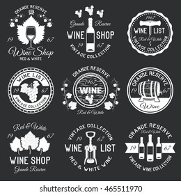 Wine monochrome emblems with grape berries and leaves corkscrews packaging ribbon on black background isolated vector illustration 