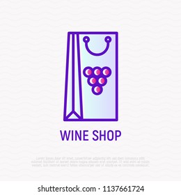 Wine packaging with grapes thin line icon. Modern vector illustration.