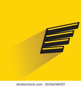 Insignia de ala con sombra sobre fondo amarillo