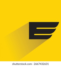 wing badge with shadow on yellow background