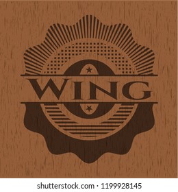 Wing badge with wooden background