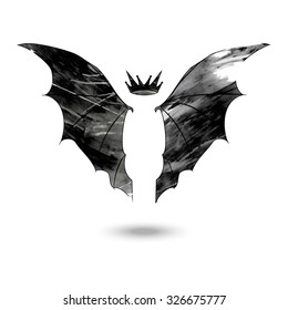 Wings of the bat with crown above made in a grunge style isolated on the white background