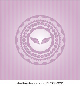 wings icon inside badge with pink background