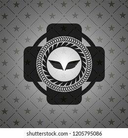 wings icon inside black emblem