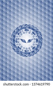 wings icon inside blue badge with geometric pattern.