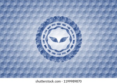 wings icon inside blue emblem or badge with geometric pattern background.