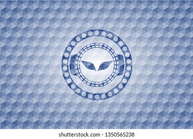 wings icon inside blue emblem with geometric pattern background.