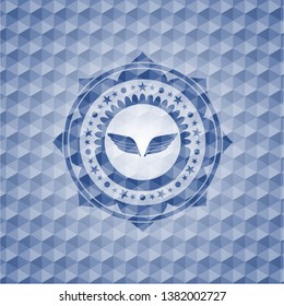 wings icon inside blue emblem or badge with abstract geometric polygonal pattern background.