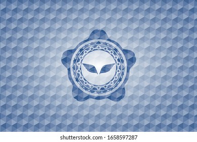 wings icon inside blue emblem with geometric pattern.